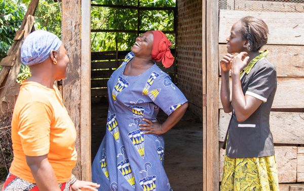 Three women from Bufaki village in Uganda who run multiple businesses and are BRAC participants