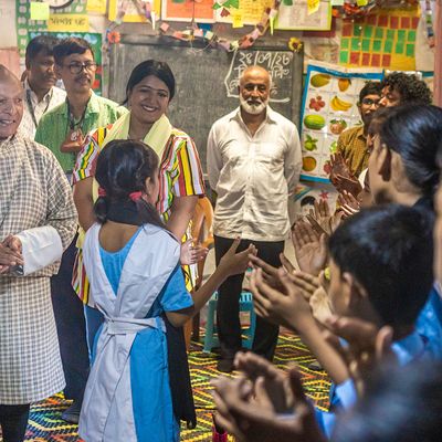 Former Education and Skills Development Minister of Bhutan, Thakur S. Powdyel enjoying an act by the students during his visit to a BRAC School.