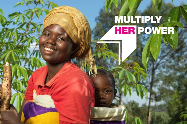 Image of a youth empowerment participant in Rwanda with "Multiply Her Power" graphic overlay