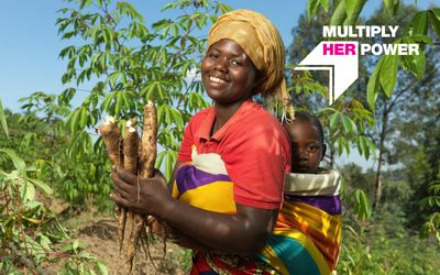 Image of a youth empowerment participant in Rwanda with "Multiply Her Power" graphic overlay