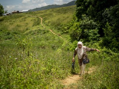 Dr Boniarah Usngan, an educator from the Bangsamoro Autonomous Region in Muslim Mindanao (BARMM) in the Philippines, walks to school.