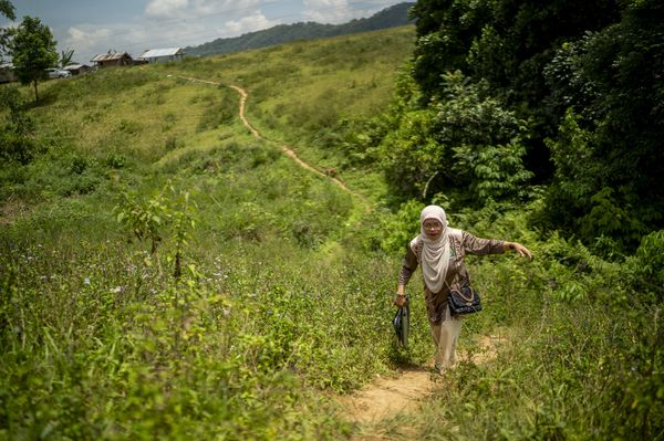 Dr Boniarah Usngan, an educator from the Bangsamoro Autonomous Region in Muslim Mindanao (BARMM) in the Philippines, walks to school.