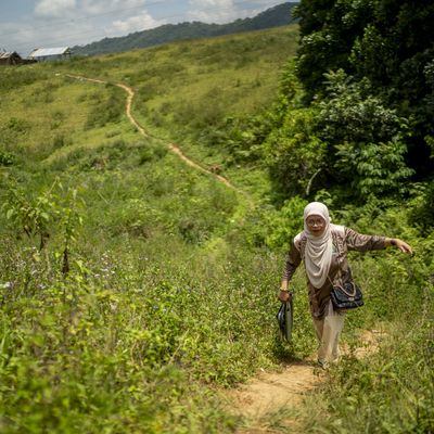 Dr Boniarah Usngan, an educator from the Bangsamoro Autonomous Region in Muslim Mindanao (BARMM) in the Philippines, walks to school.