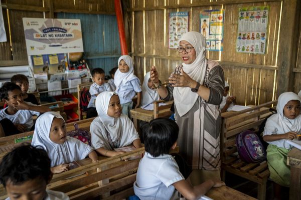 Dr Boniarah Usngan, an educator from the Bangsamoro Autonomous Region in Muslim Mindanao (BARMM) in the Philippines, teaches children in a school.