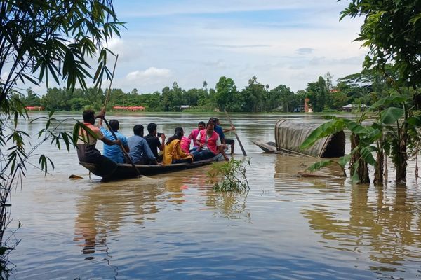 In Sreemangal Upazila, within the Moulvibazar district of Bangladesh, a team of BRAC staff travel by row boat to reach families in need of aid.