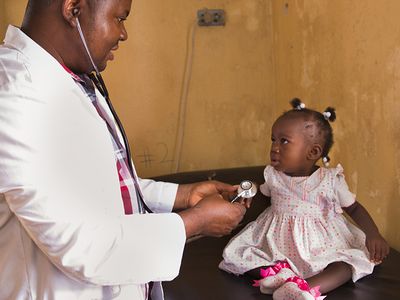 Doctor treating a child