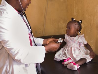 Doctor treating a child