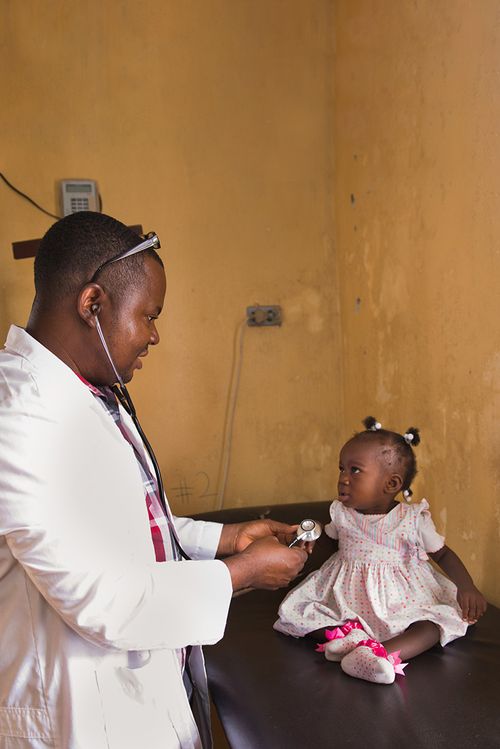 Doctor treating a child