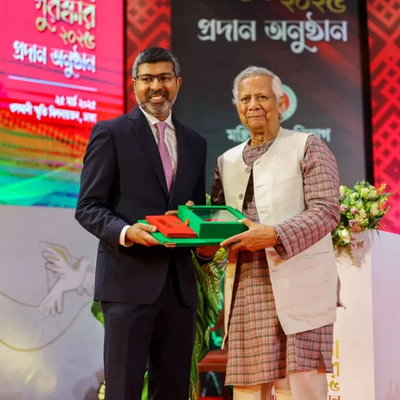 Shameran Abed accepts the Independence Award on behalf of BRAC founder Sir Fazle Hasan Abed, from Chief Advisor to the Government of Bangladesh, Dr. Muhammad Yunus