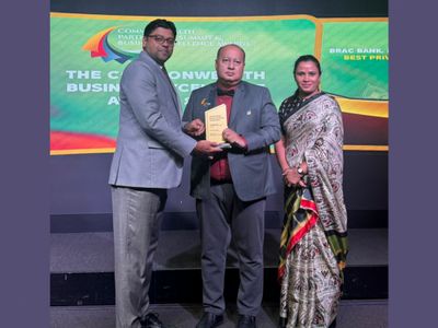 Two men and a woman accept a prize on behalf of BRAC Bank