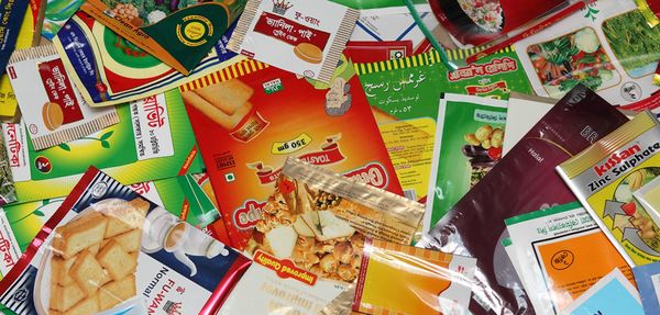 Various colorful plastic packaging packets are shown