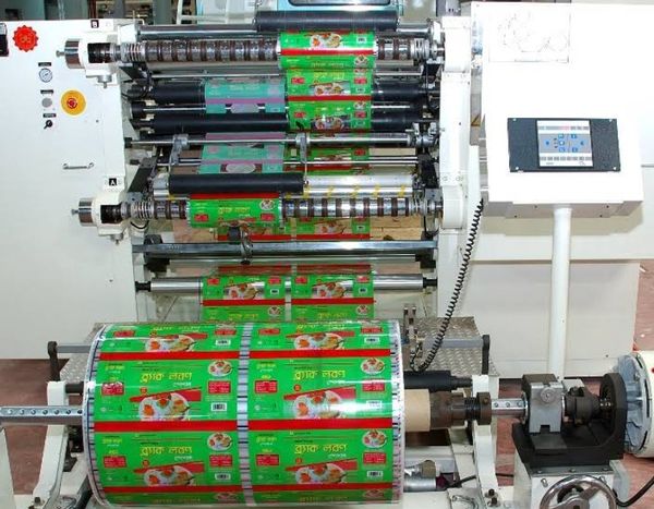 green and red packets are shown on a production machine