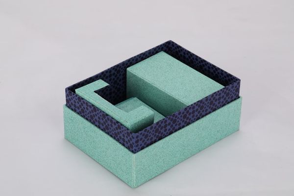 A group of blue boxes nest together