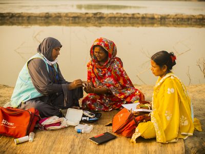 Community health volunteer giving service