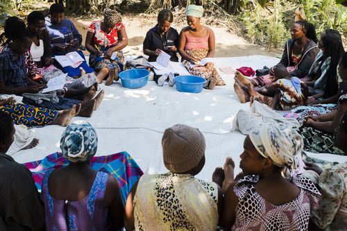 A village community meets to access inclusive finance