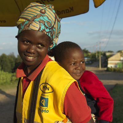 BRAC Rwanda, mother with her son on her back