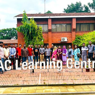 A BRAC Bank team poses for a photo at a BRAC Learning Centre