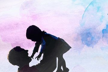 A man holds his daughter in the air with blue and pink sepia tones behind