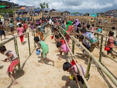 Children running for lunch at Thaingkhali Camp.