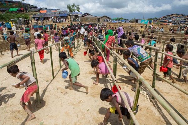 Children running for lunch at Thaingkhali Camp.