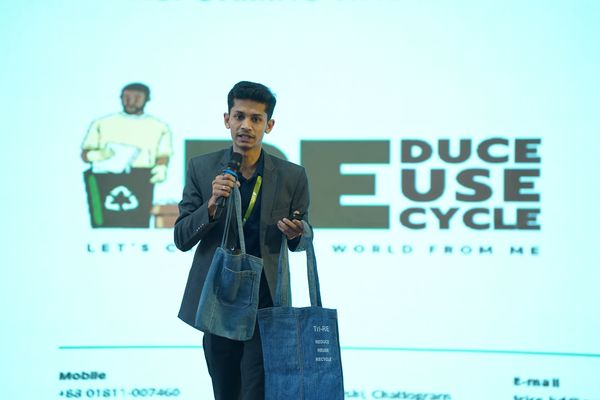 Rimon speaking on stage about TriRE