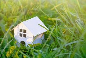 DBH Loan home amid grass image