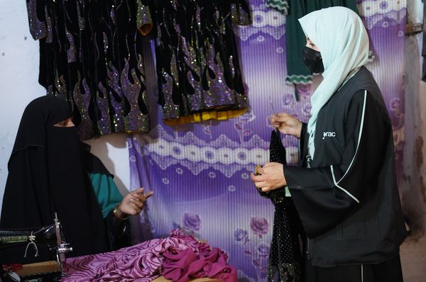 Two women in Afghanistan at a tailoring shop