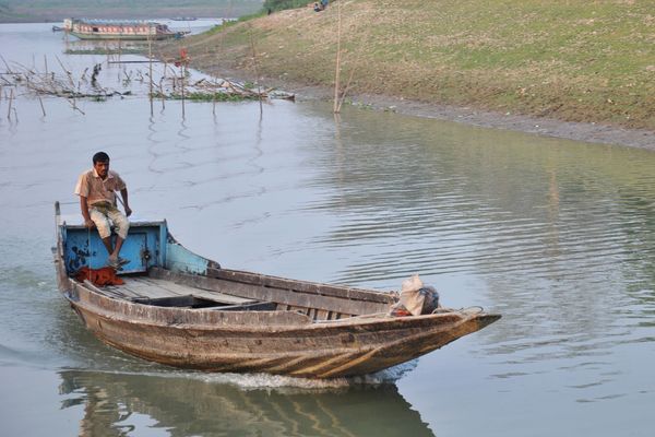 A man in a boat in flood-prone Bangladesh