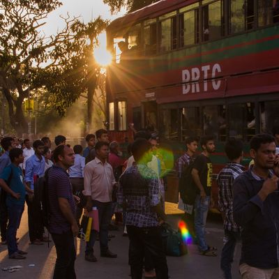 BRAC Bangladesh | Urban Development, people walking on the street at dusk
