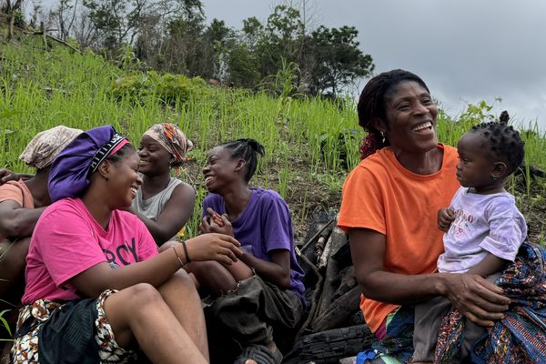 Dede with her daughters and grandchild at her farm in Liberia. Photo: Shituma Tajrin, 2025.