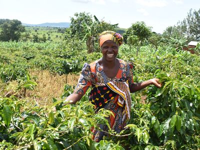 Woman smiling outside in a field