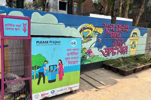 A behavior change project tests if a colorful site for a trash can will encourage people to throw their trash in designated places.