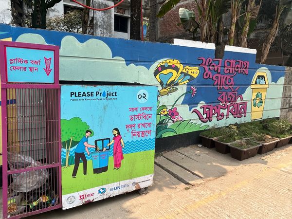 A behavior change project tests if a colorful site for a trash can will encourage people to throw their trash in designated places.