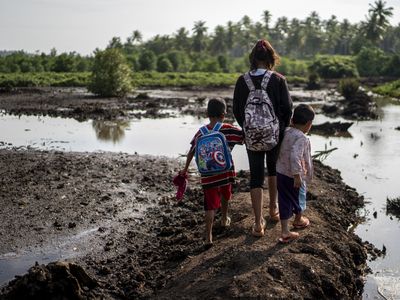 Sitti crosses a forest and a river just to get to school. - Header Image