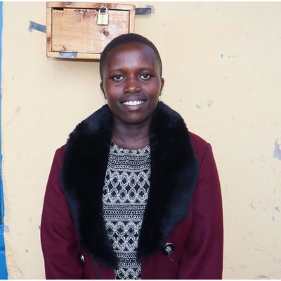 A portrait of Liliane smiling