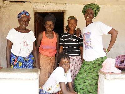 Group of BRAC Microfinance Sierra Leone clients smiling and posing