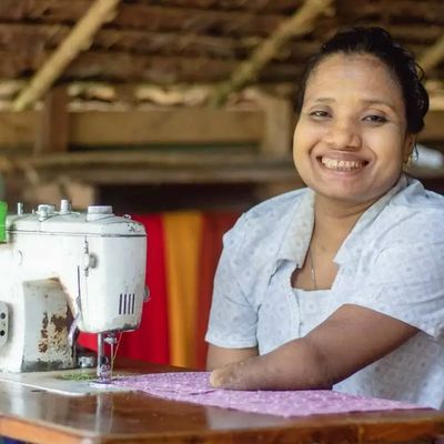 Myanmar client with sewing machine