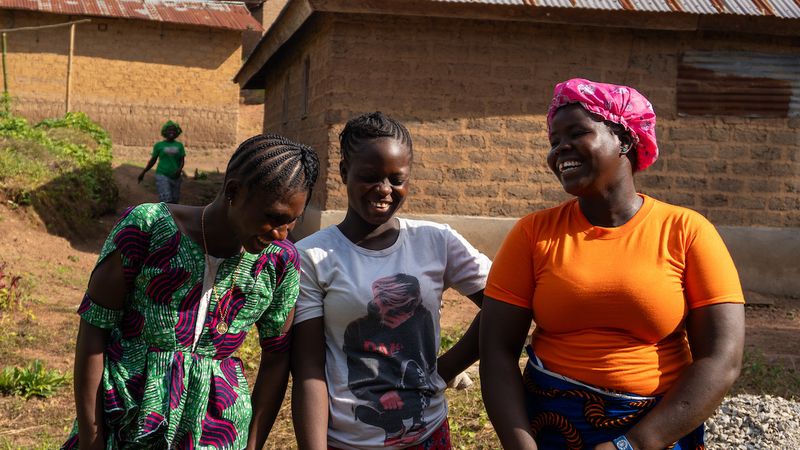 Three AIM club participants laughing at Voinjama, Liberia, June 2026