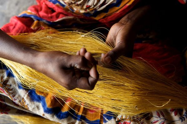 A woman works with silk thread at the BRAC Taraganj Reeling Centre in Taraganj upazila, Ranpur district, Bangladesh