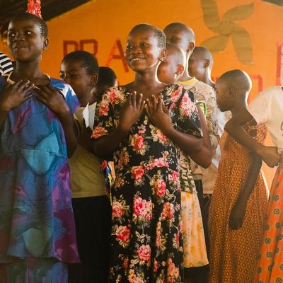Group of girls standing together in colourful clothes