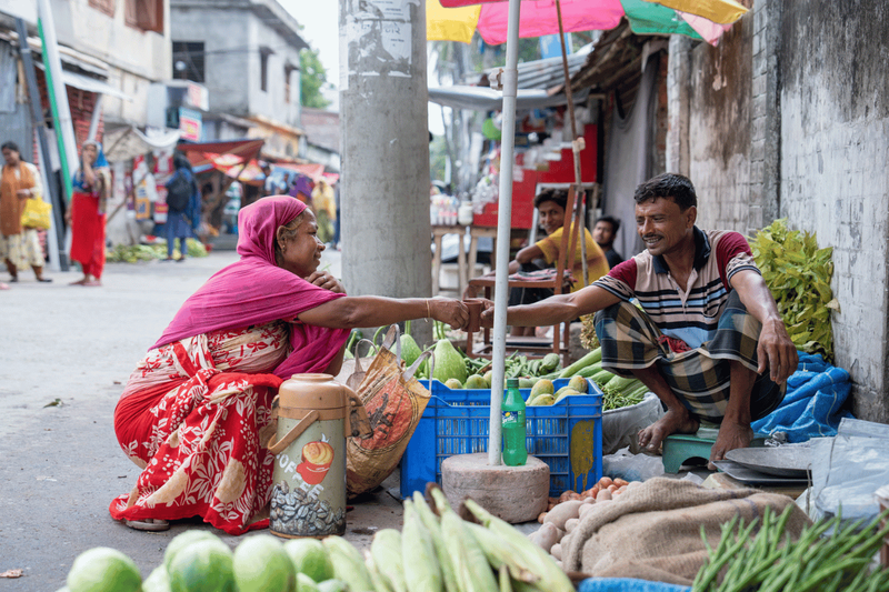 women buying fruit