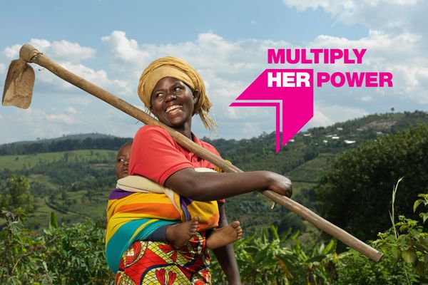 BRAC Rwanda, Angelique and her son in her fields. Angelique is part of the AIM program. On top of the image is a logo that says Multiply Her Power