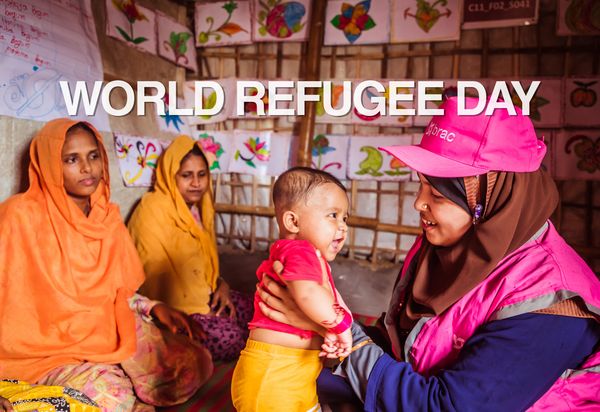 BRAC worker in Rohingya refugee camps holds baby with WRD overlay
