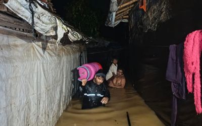_Camp 06 CCCM Volunteers_ are actively rescuing children and elderly persons from flood-affected areas and safely relocating them to designated shelters. At the same time, they are assisting affected families by carrying their essentia (1) copy