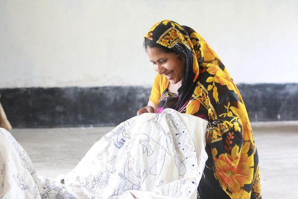 Woman stitching kantha