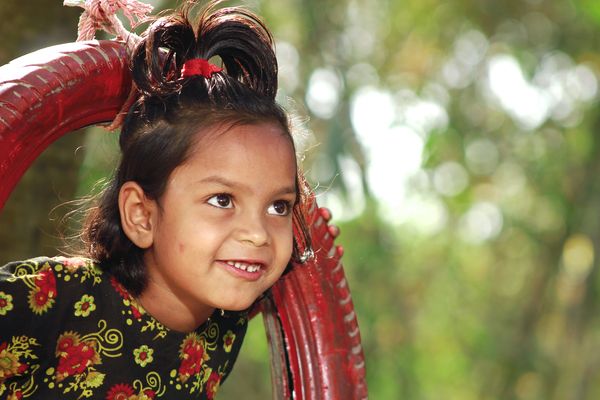 Early childhood development - play lab child on swing