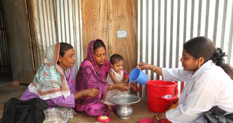 At home visit from a community health worker in Bangaldesh.