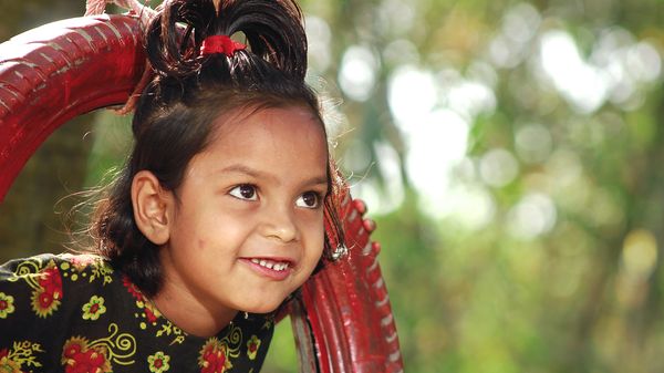 Early childhood development - play lab child on swing