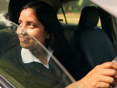 BRAC Bangladesh road safety - Srimti Banita Khalko sitting in her car, proud of her new identity.
