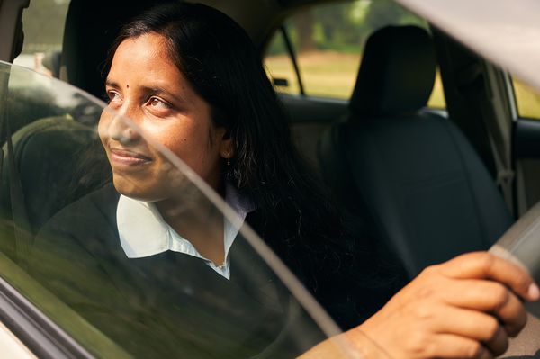 BRAC Bangladesh road safety - Srimti Banita Khalko sitting in her car, proud of her new identity.